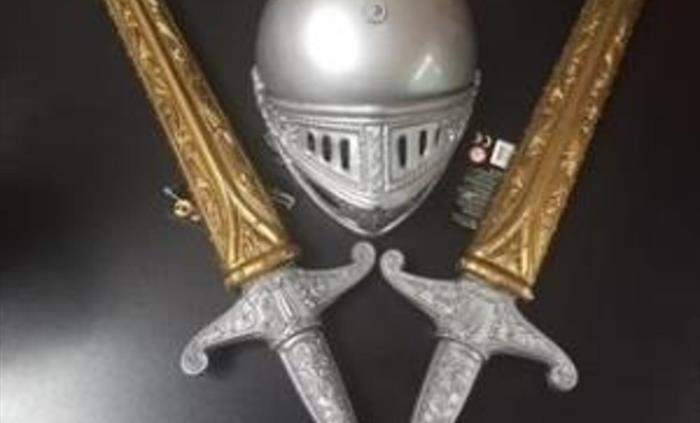 2 swords and a helmet